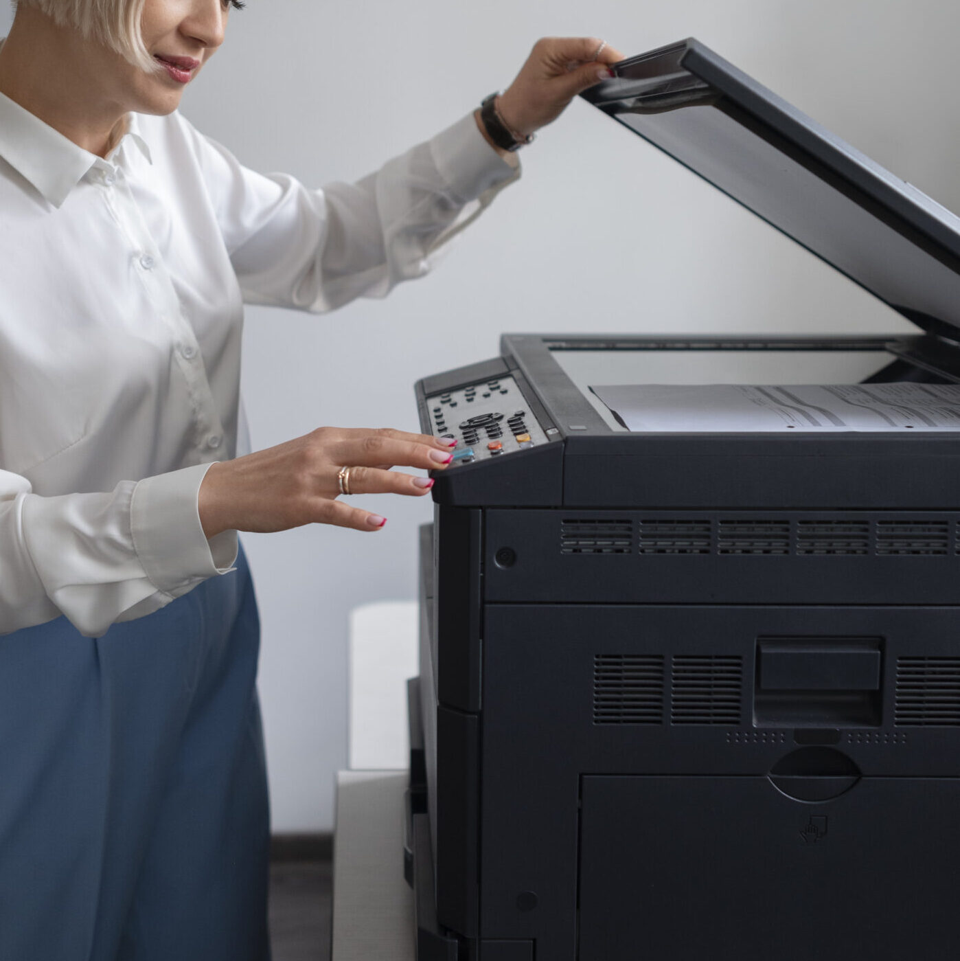 woman work office using printer scaled e1722605602453