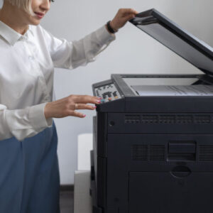 woman work office using printer scaled e1732013496954